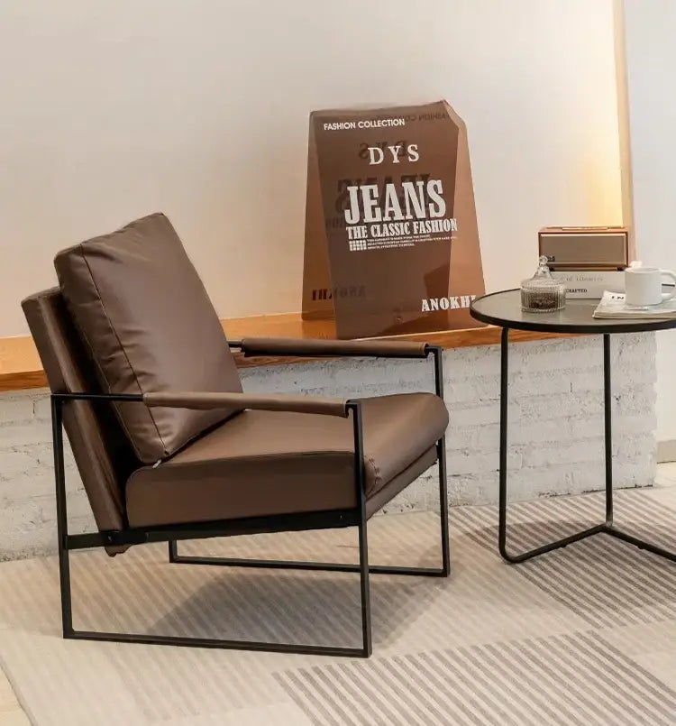 Modern brown leather lounge chair reception area black metal frame