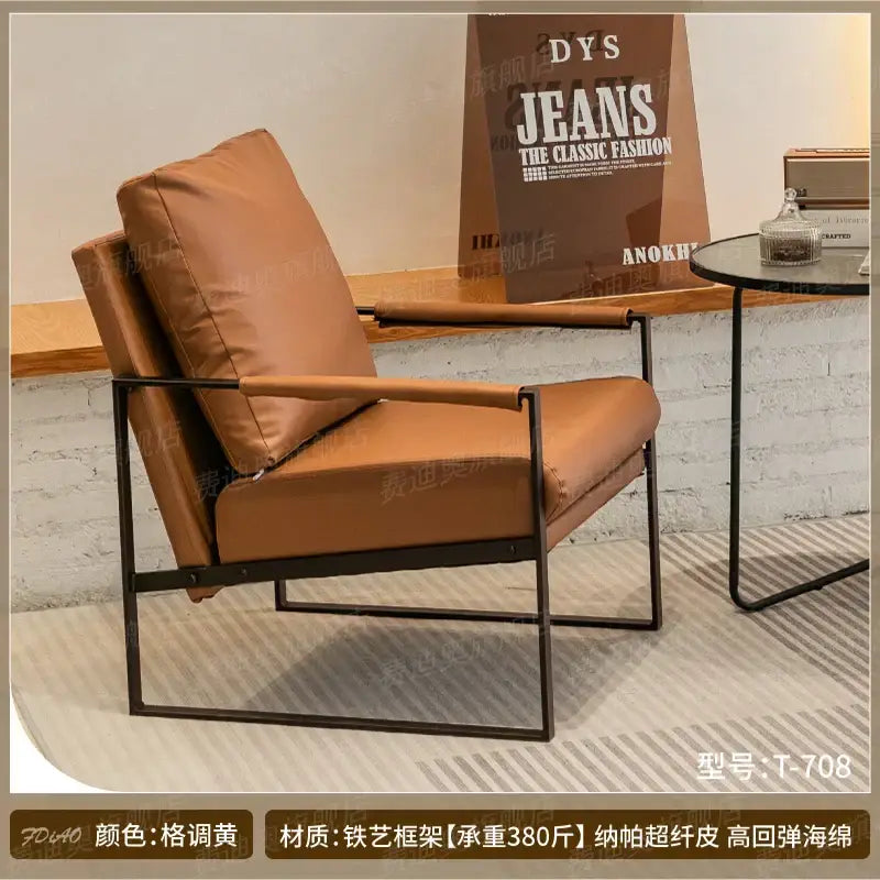 Modern brown leather lounge chair reception area black metal frame