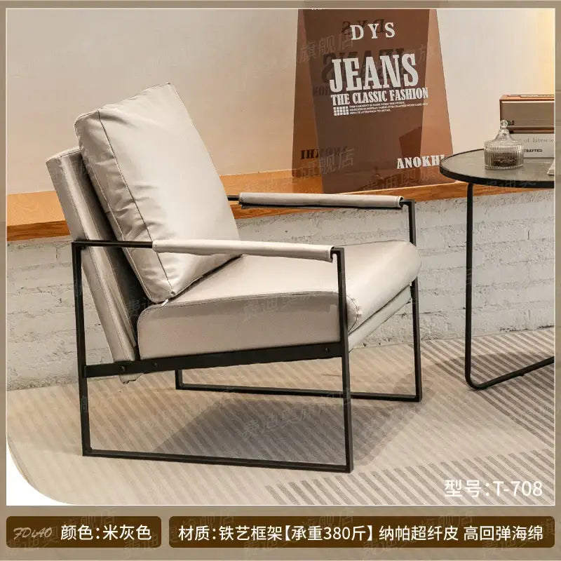 Brown leather single sofa chair with black metal frame for reception