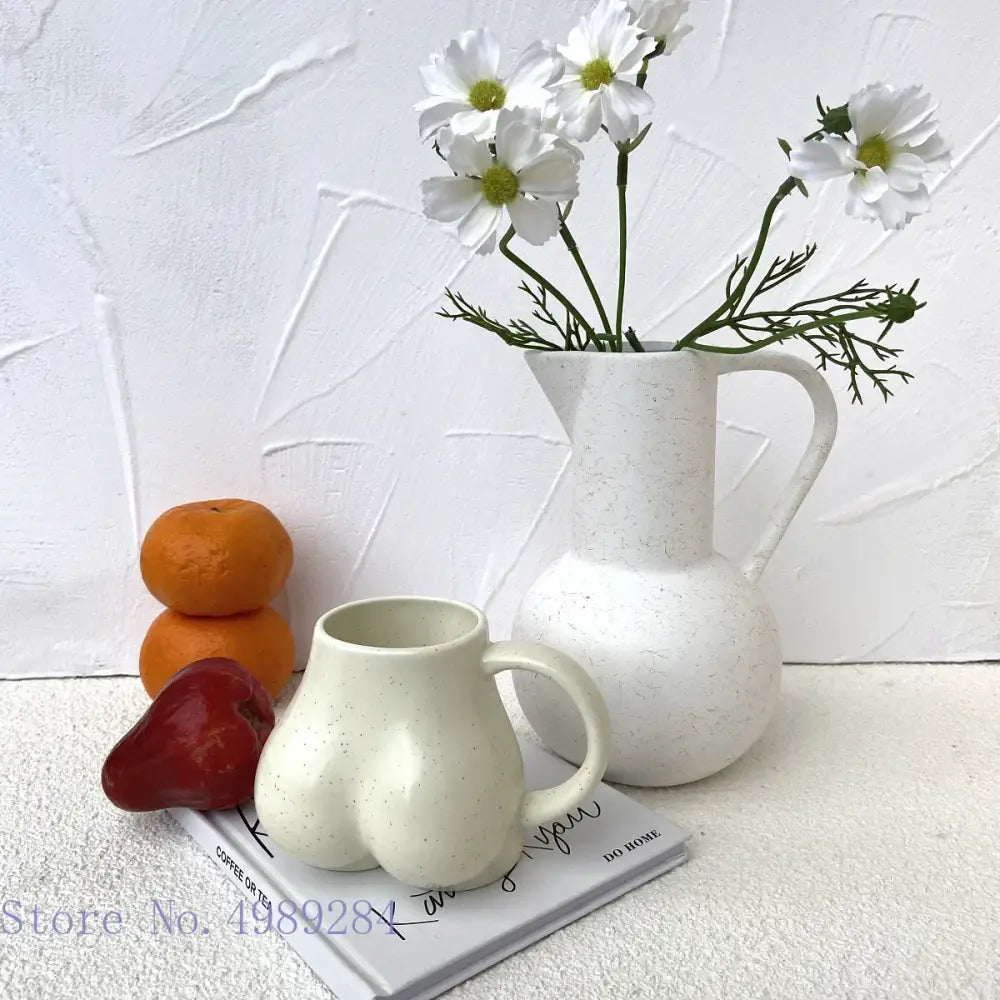 Playful white speckled butt shape ceramic coffee cup kitchen decor