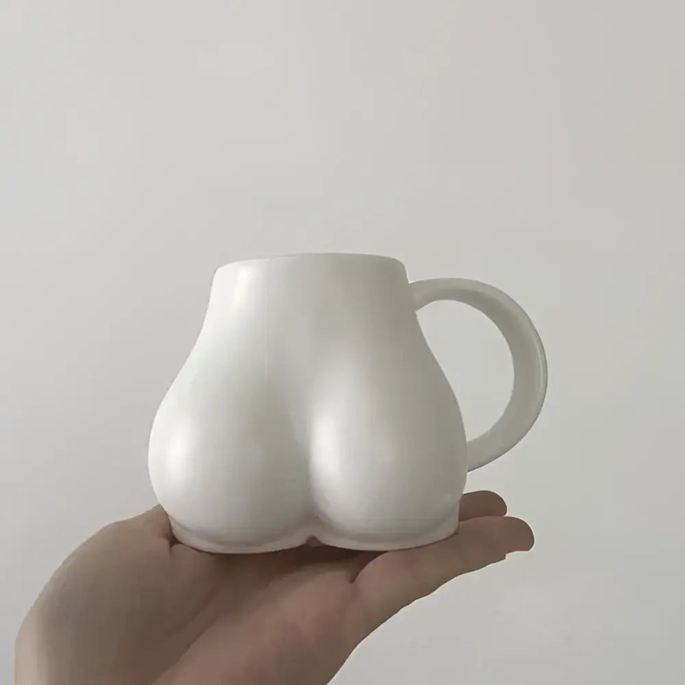 Playful white speckled butt shape ceramic coffee cup kitchen decor