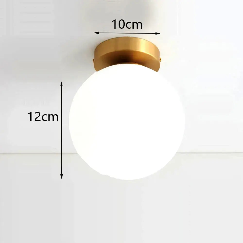 Modern brass ball ceiling light for living room with frosted glass