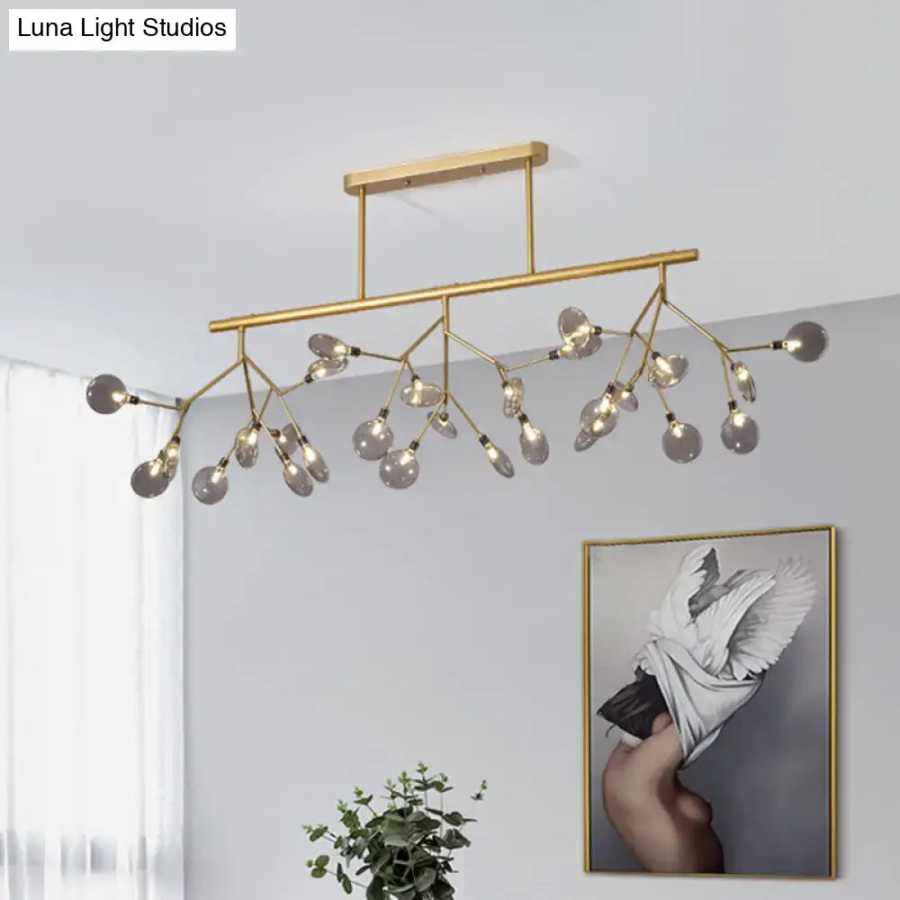Modern gold firefly island pendant – dining room glass globe light