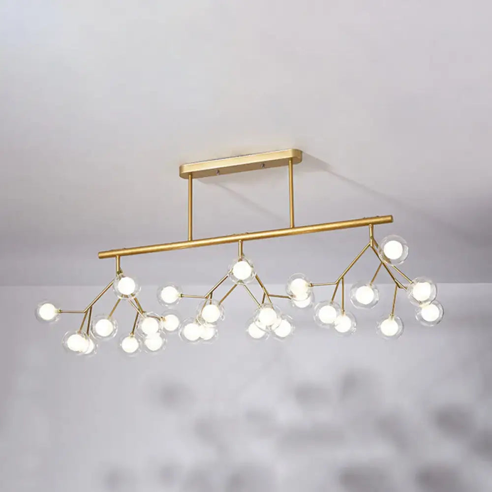 Modern gold firefly island pendant – dining room glass globe light