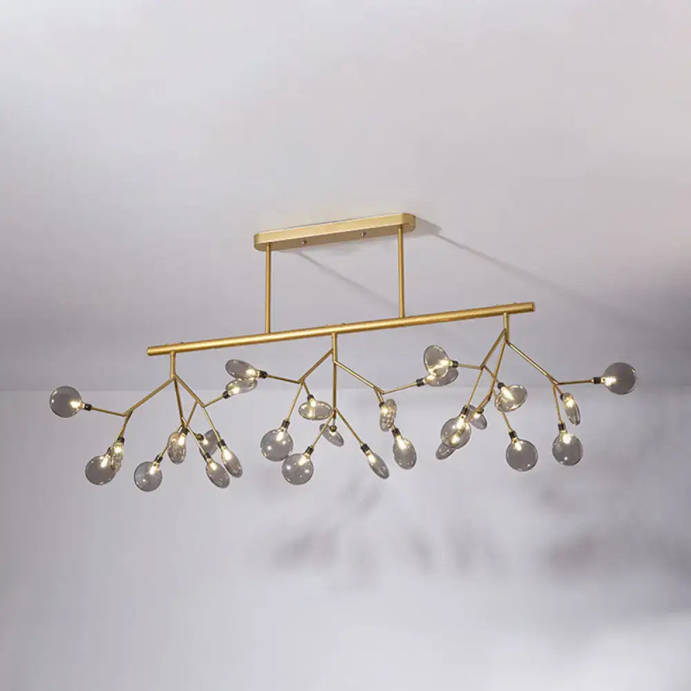 Modern gold firefly island pendant – dining room glass globe light