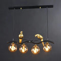 Modern bird branch island pendant light – dining room amber glass