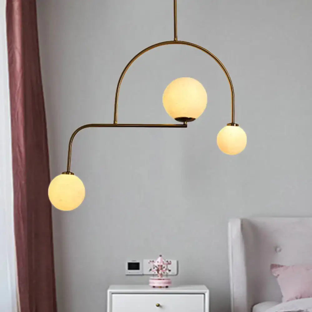 Modern gold global bedroom pendant light with white frosted glass