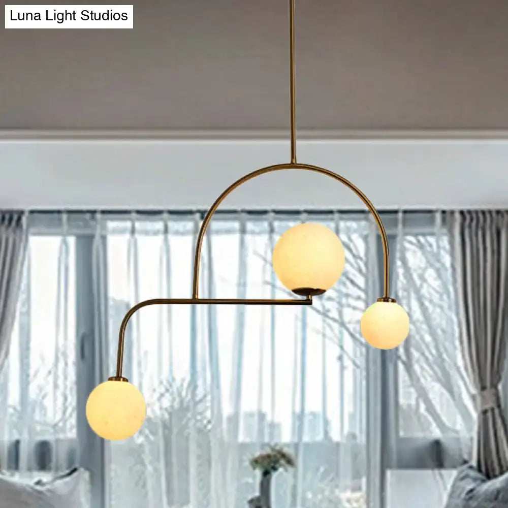 Modern gold global bedroom pendant light with white frosted glass