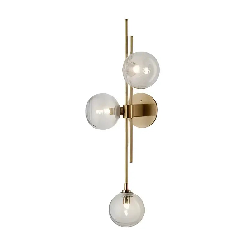 Modern gold wall sconce with textured glass globes for bedroom