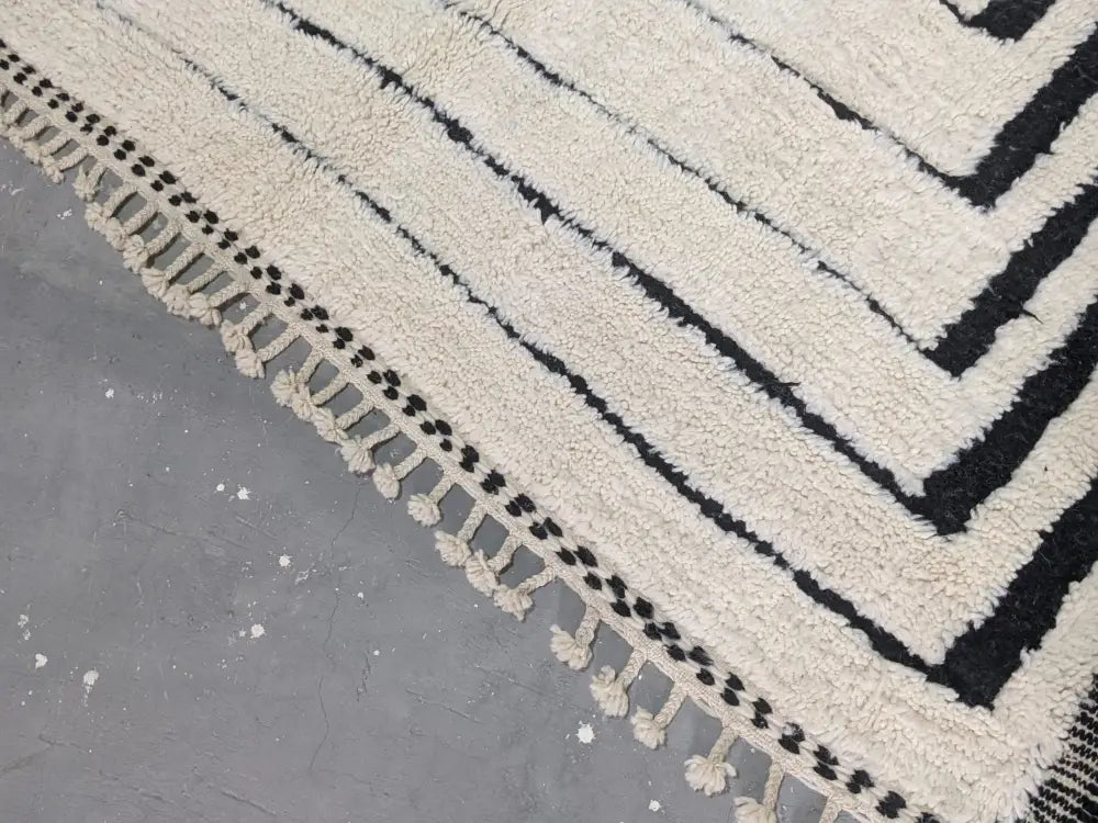 Handmade cream and black beni ouarain rug living room decor