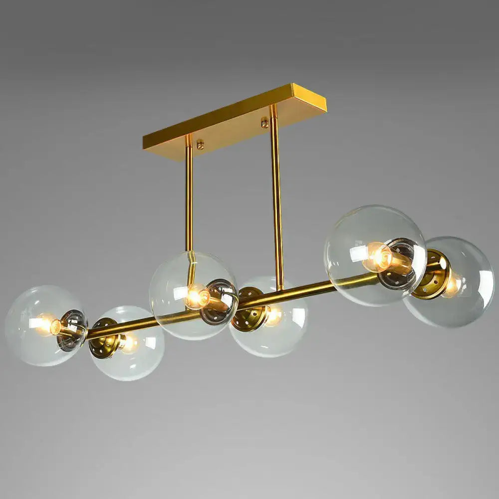 Postmodern gold kitchen island light with globe glass shade