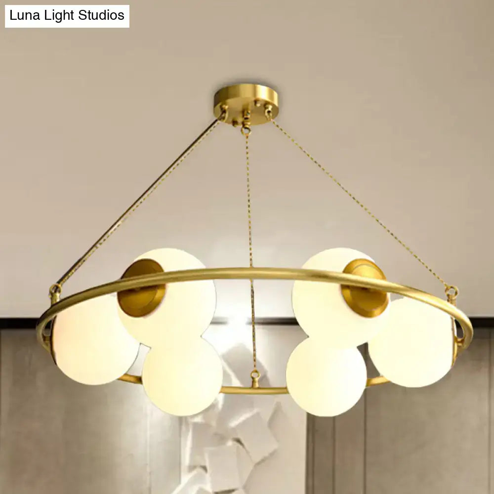 Postmodern brass circular chandelier with frosted glass dining room