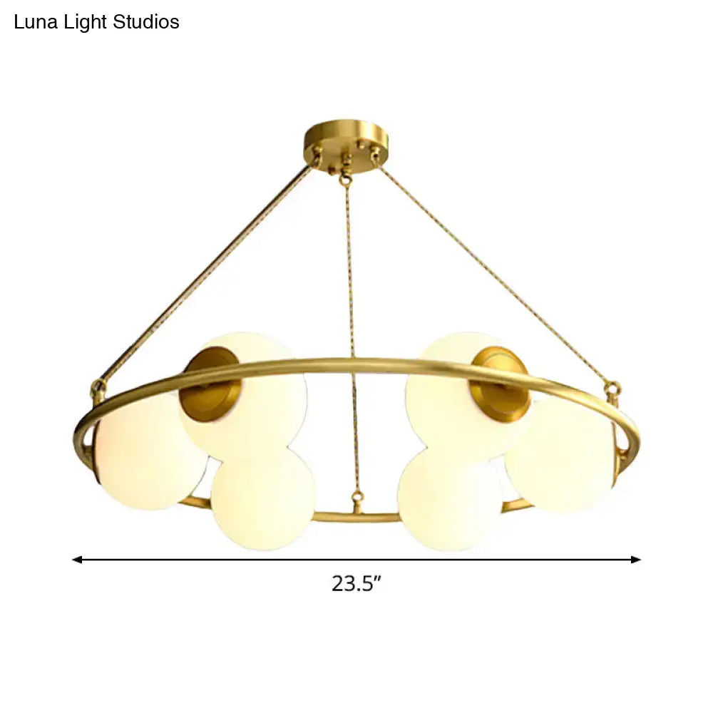 Postmodern brass circular chandelier with frosted glass dining room