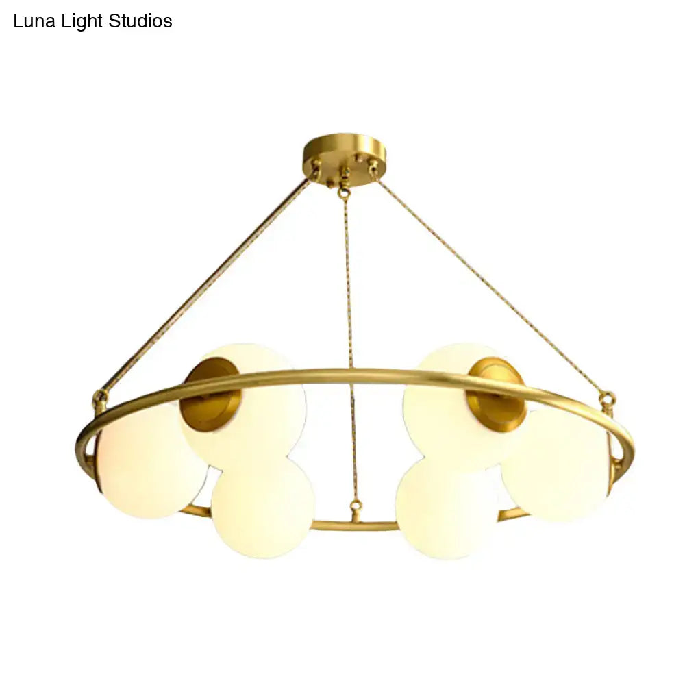 Postmodern brass circular chandelier with frosted glass dining room