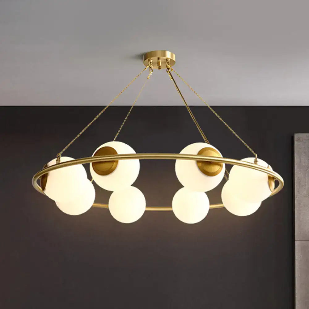 Postmodern brass circular chandelier with frosted glass dining room