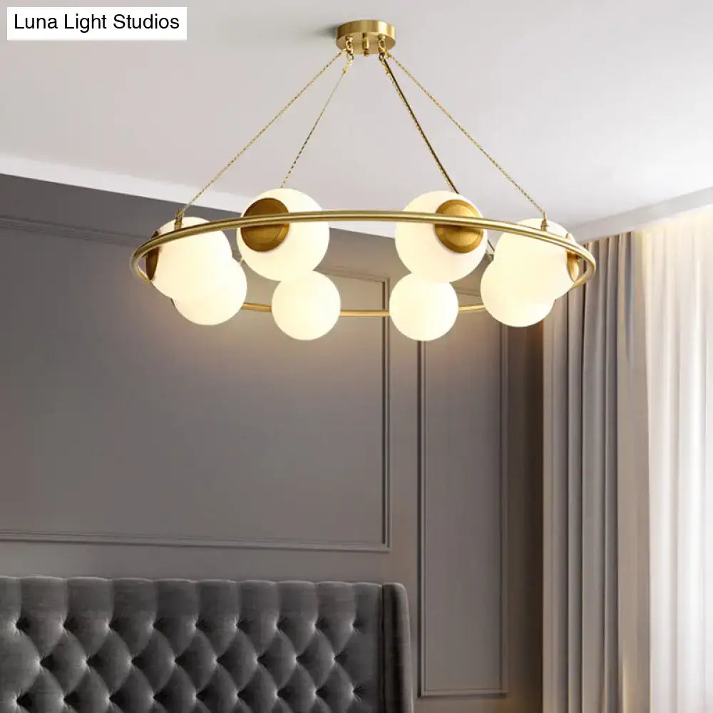 Postmodern brass circular chandelier with frosted glass dining room