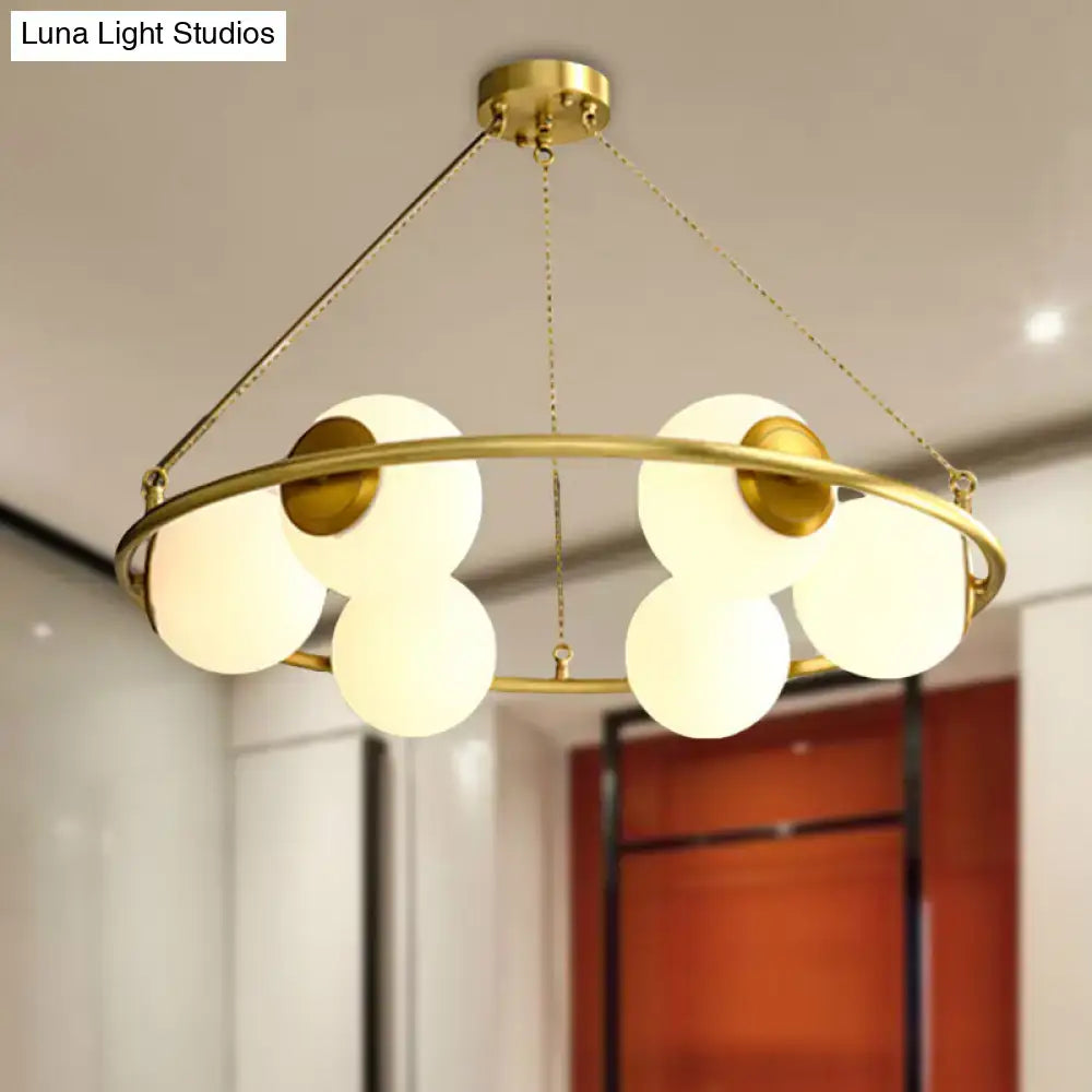 Postmodern brass circular chandelier with frosted glass dining room