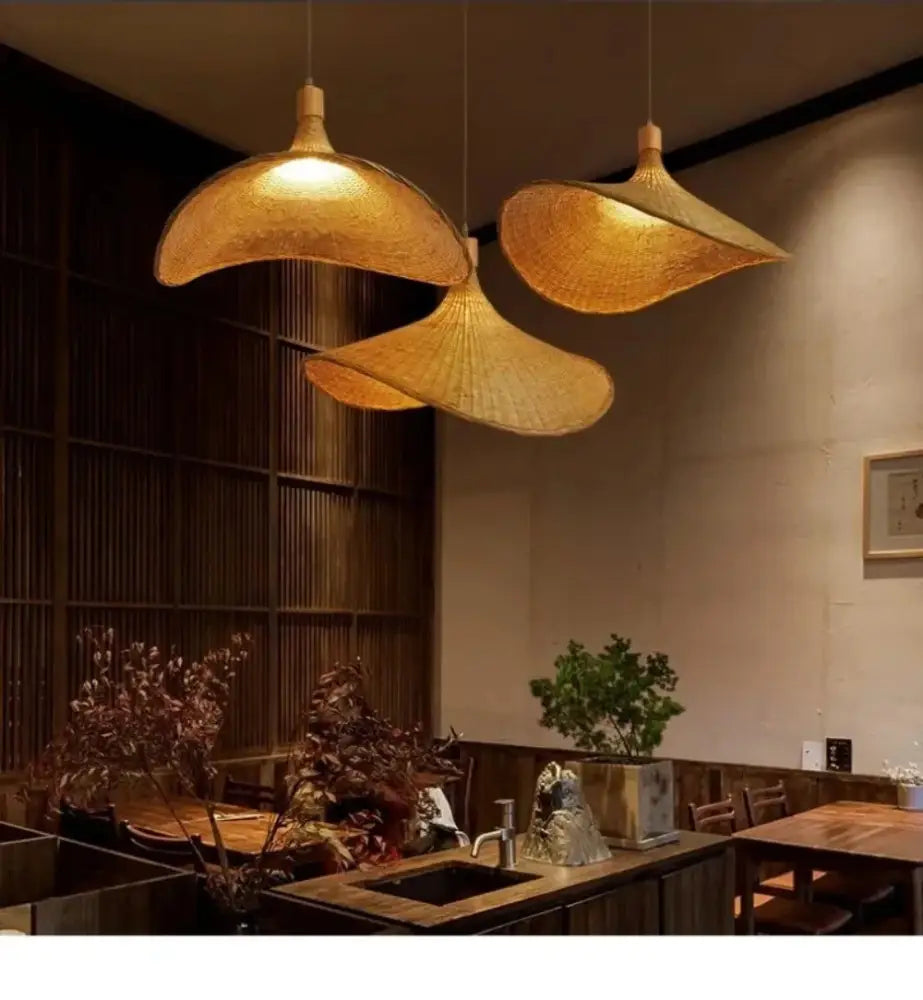 Woven golden brown rattan pendant light with dimmable bamboo shade dining room