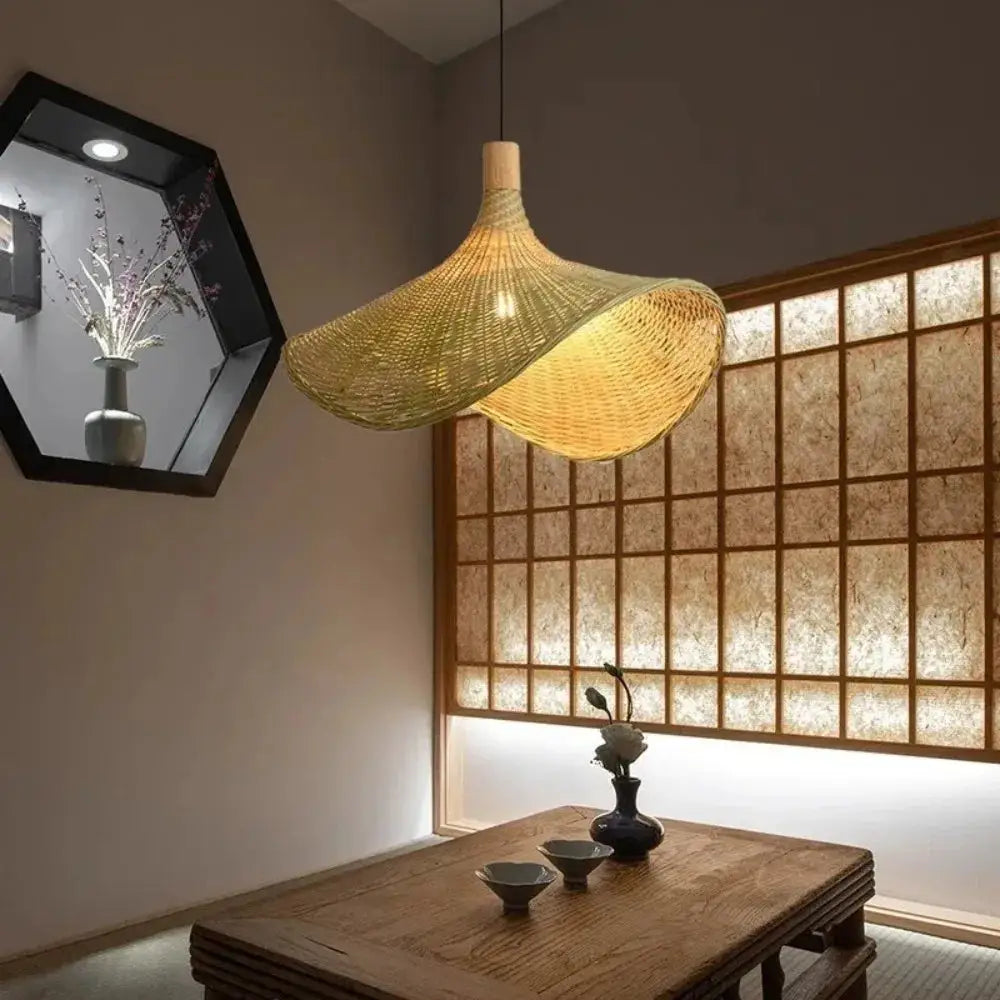 Woven golden brown rattan pendant light with dimmable bamboo shade dining room