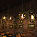 Industrial retro bicycle ceiling light with plant decor dining room