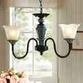 Rustic blackish green floral chandelier with frosted glass living room