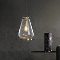 Modern seeded glass pendant light with brass rim bedroom
