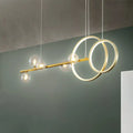 Modern gold ring ceiling light with clear glass sphere dining room