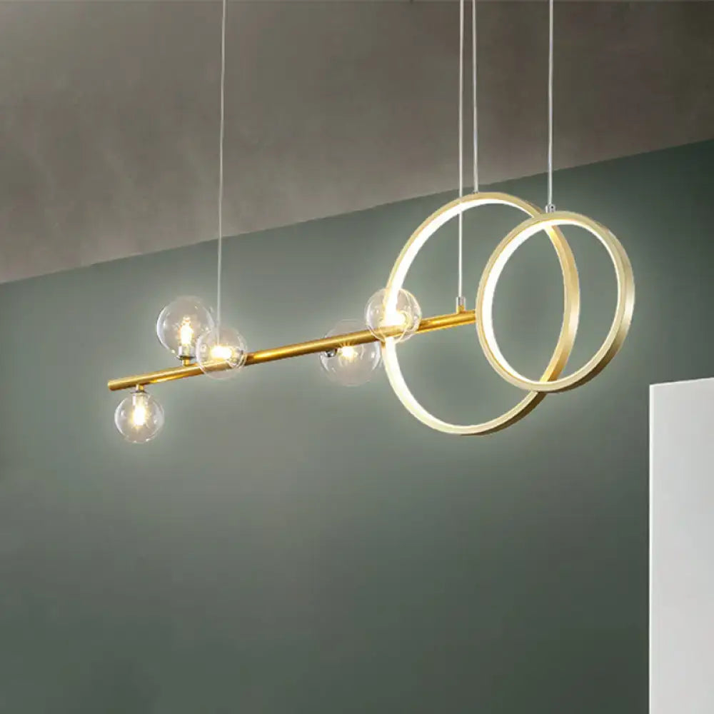 Modern gold ring ceiling light with clear glass sphere dining room