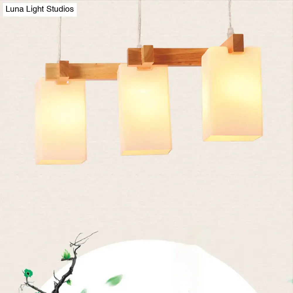 Minimalist wood island pendant light with opaline glass dining room