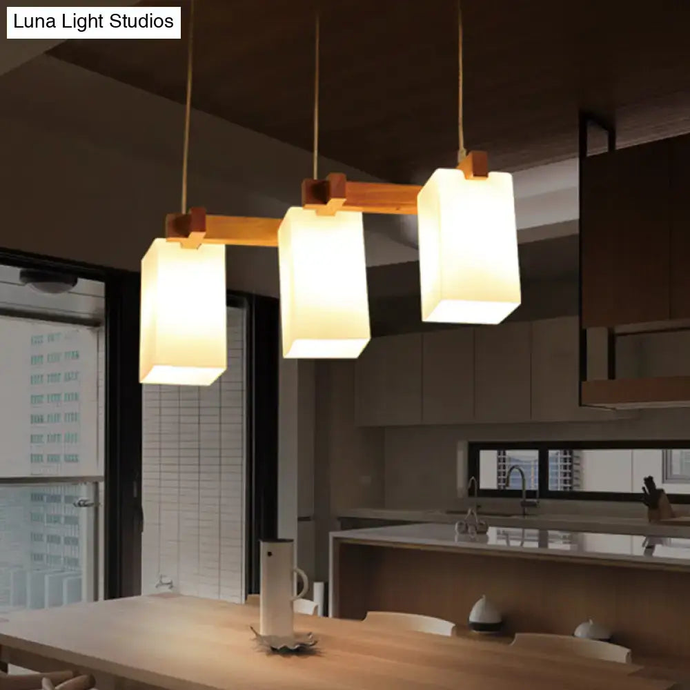 Minimalist wood island pendant light with opaline glass dining room