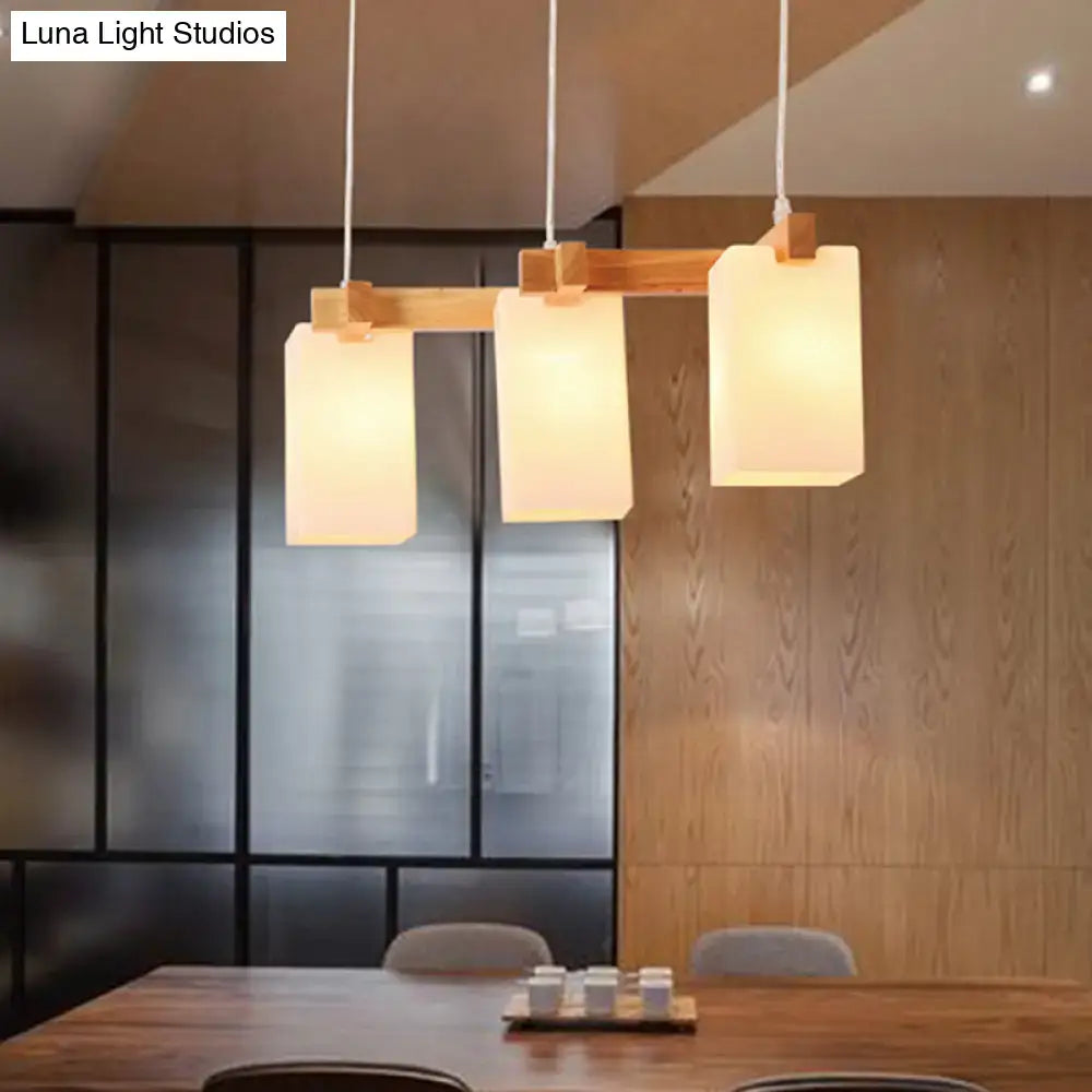 Minimalist wood island pendant light with opaline glass dining room