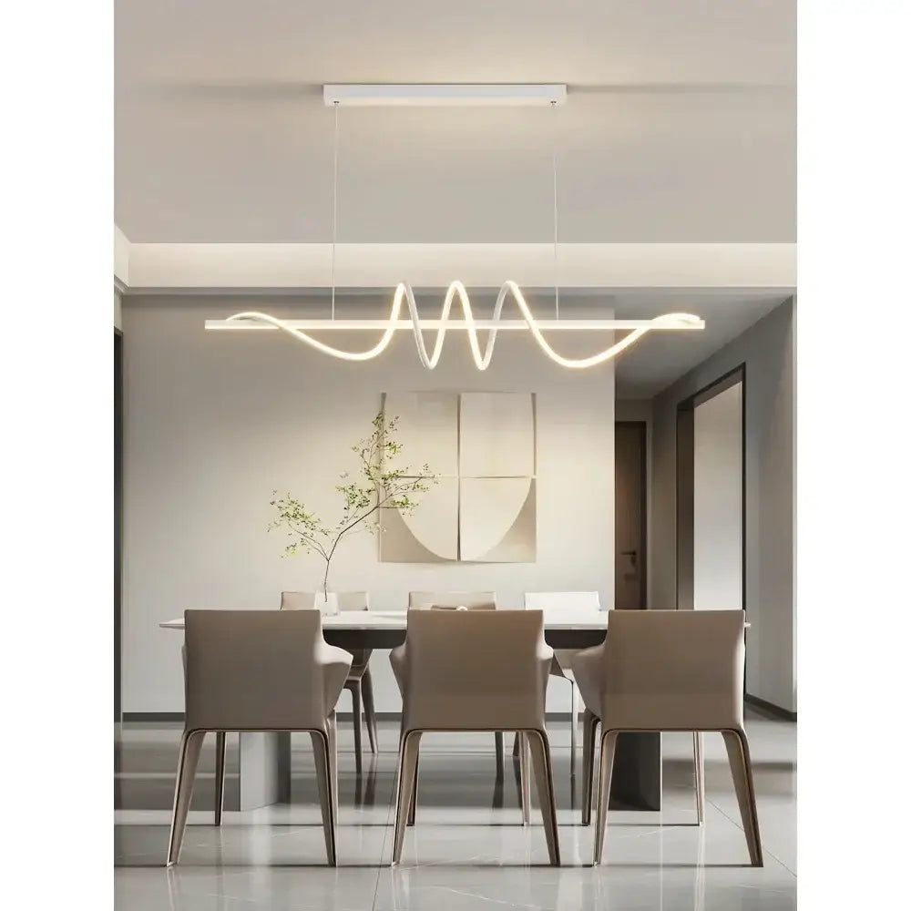 Sleek wavy pendant lights for dining room with brushed metallic finish