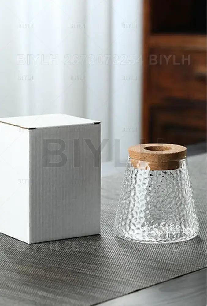 Small transparent glass vase with bamboo base for living room decor
