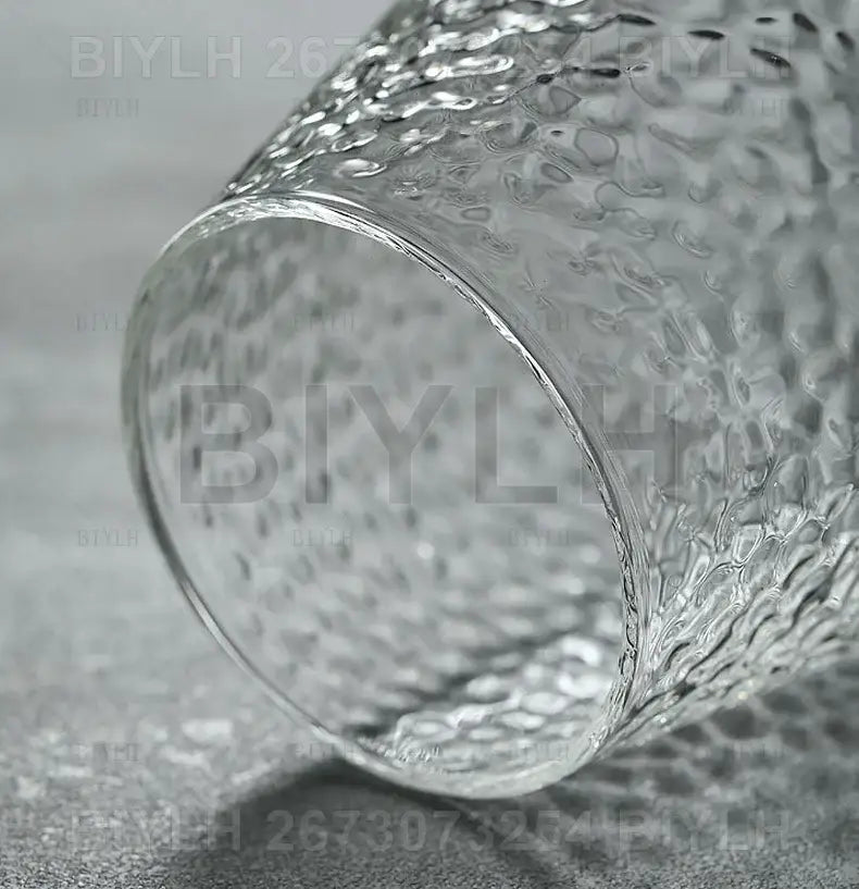 Small transparent glass vase with bamboo base for living room decor