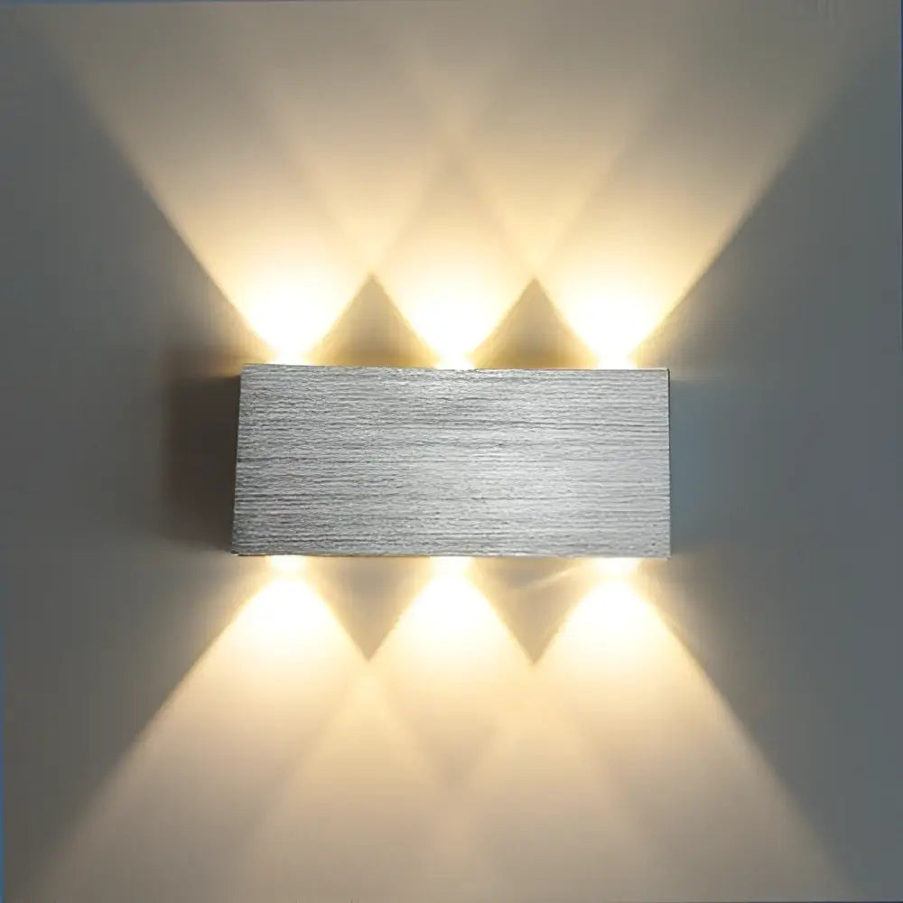Modern brushed silver sphera wall sconces bedroom warm light beam