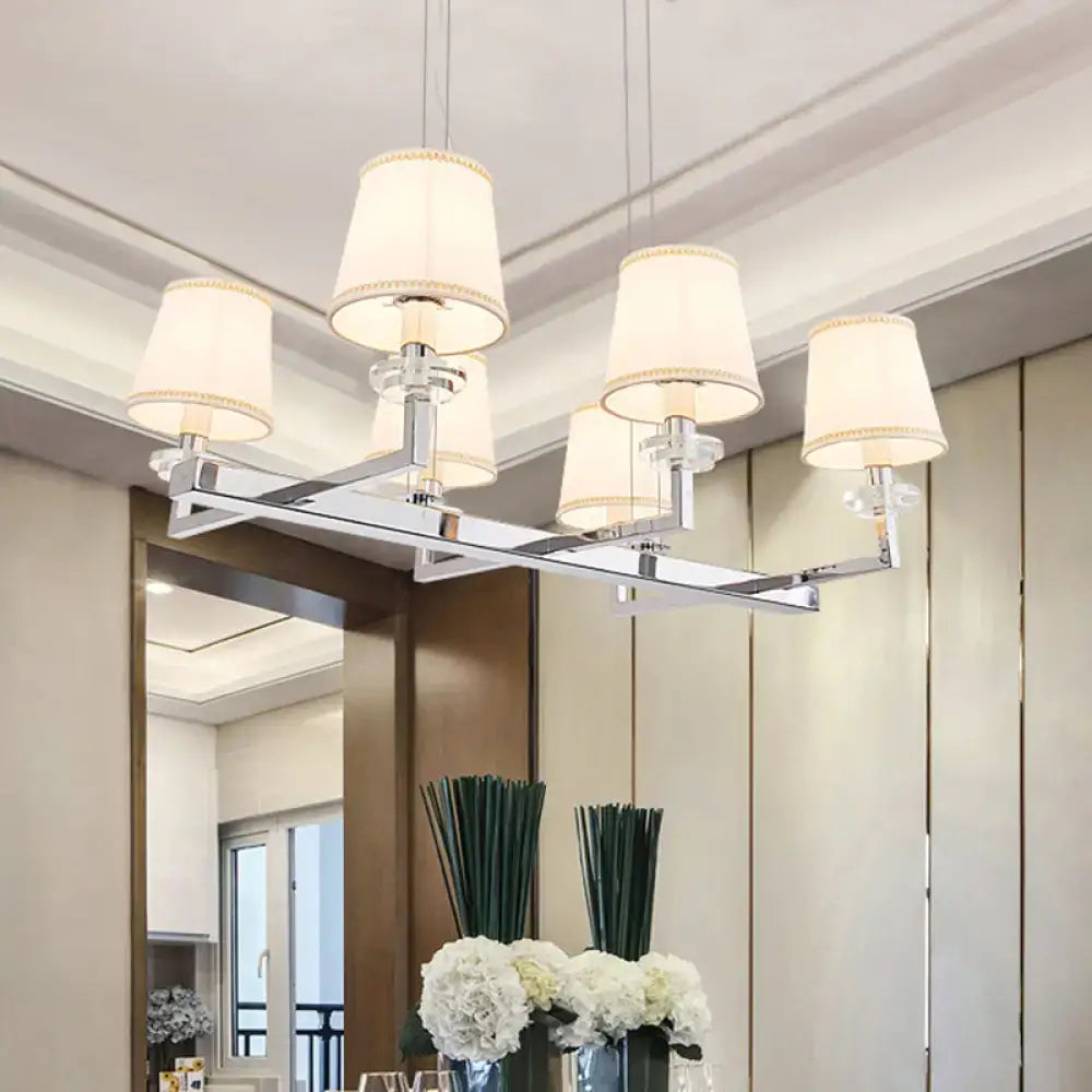 Modern chrome pendant light fixture with fabric shades dining room