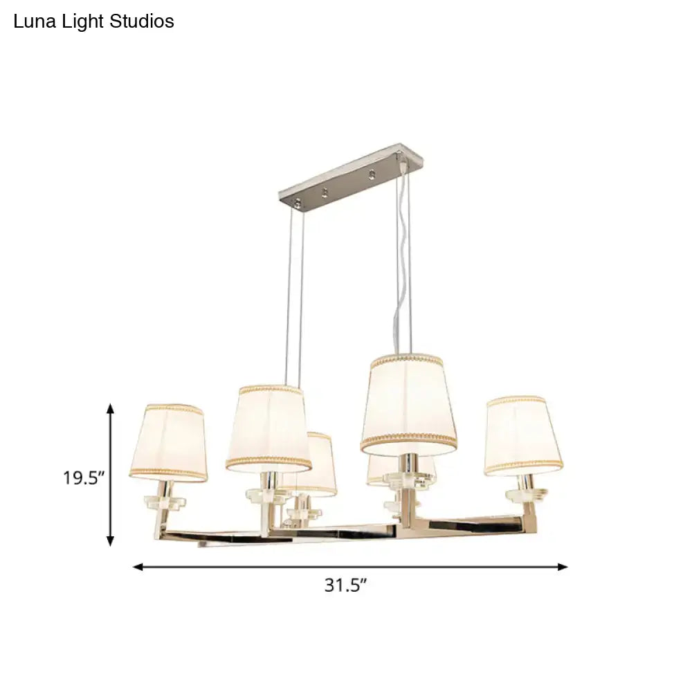 Modern chrome pendant light fixture with fabric shades dining room