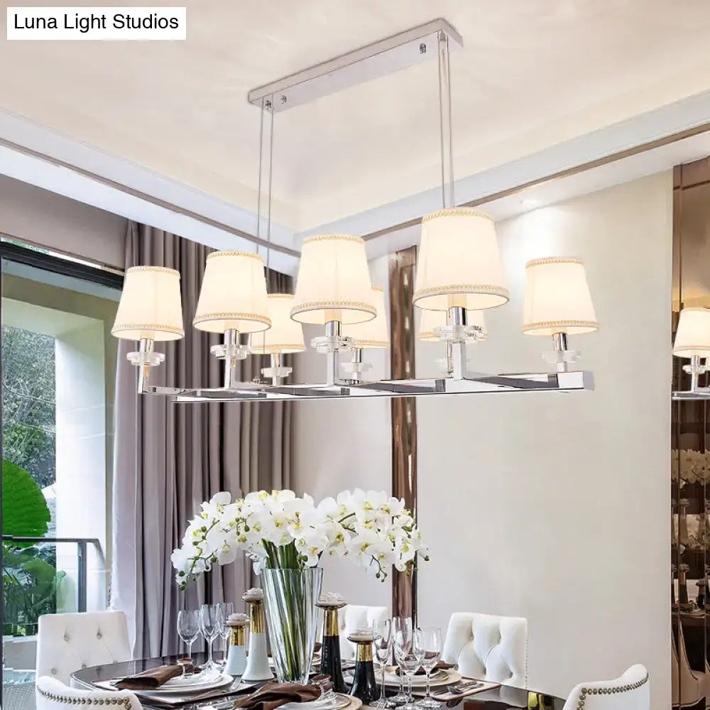 Modern chrome pendant light fixture with fabric shades dining room