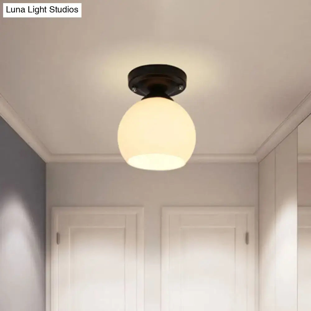 Vintage bronze semi flush ceiling light with glass shade hallway