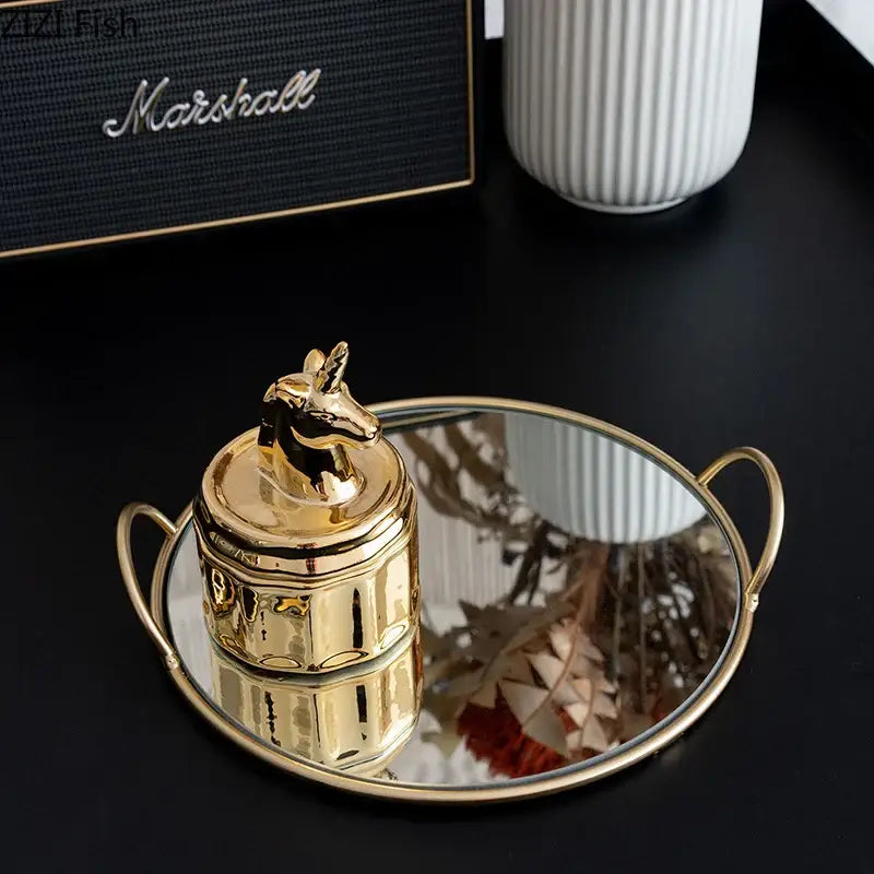 Elegant giraffe gold ceramic jar and brass handle storage tray dining room