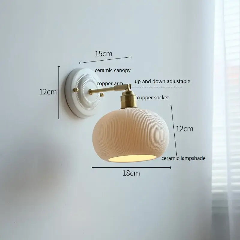 Fluted cream ceramic wall lamp with brass accents – bathroom light