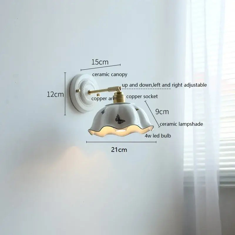 Fluted cream ceramic wall lamp with brass accents – bathroom light