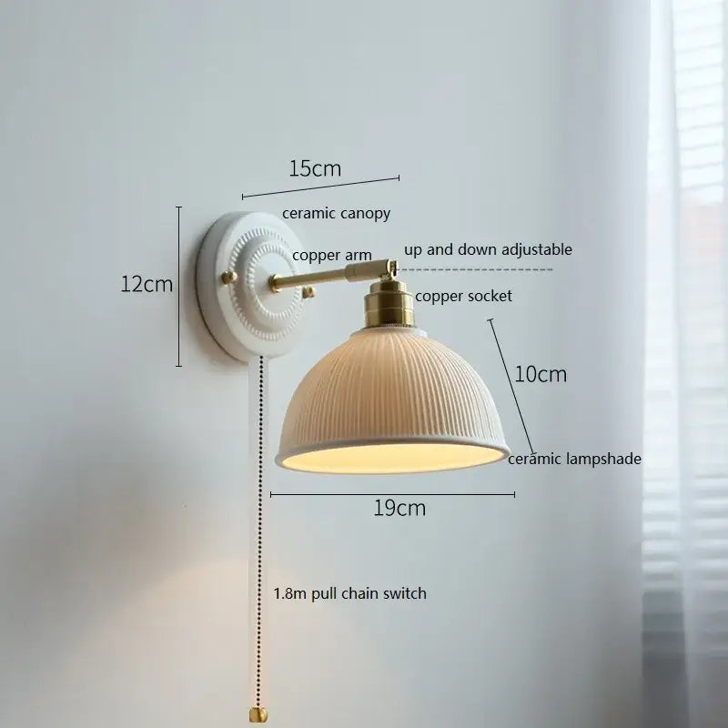Fluted cream ceramic wall lamp with brass accents – bathroom light