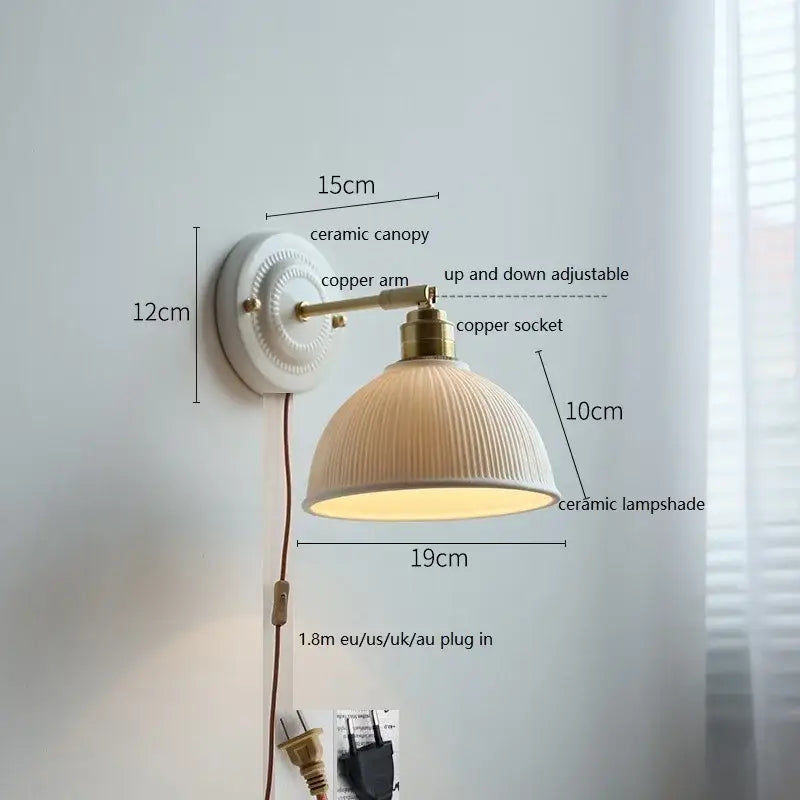 Fluted cream ceramic wall lamp with brass accents – bathroom light