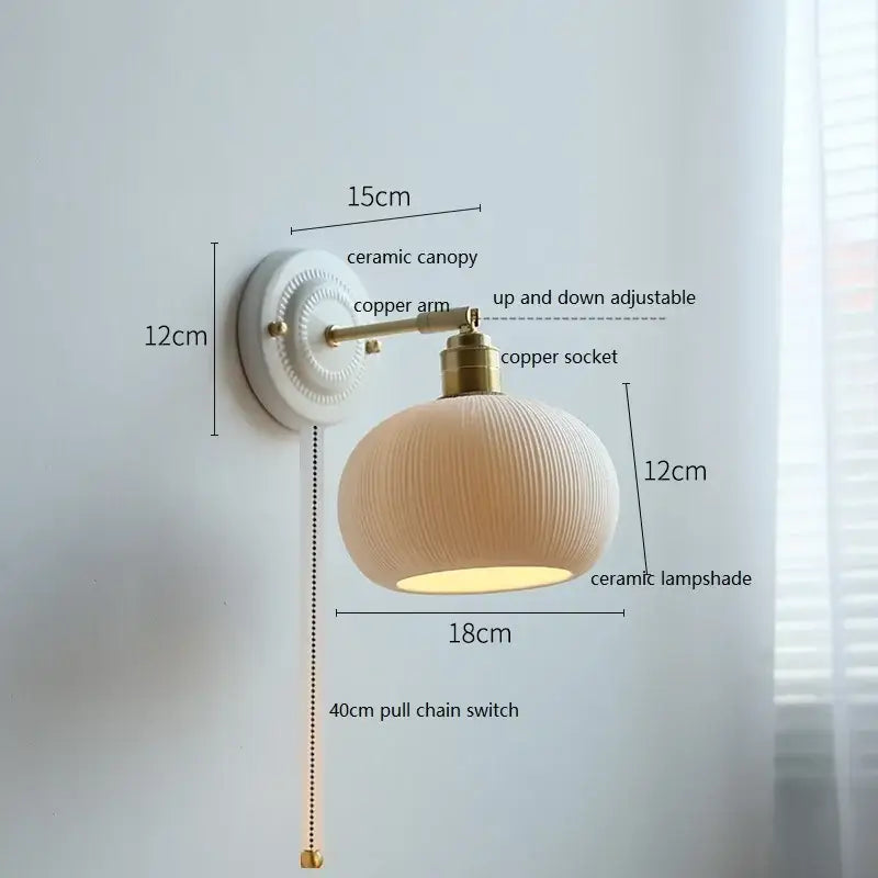 Fluted cream ceramic wall lamp with brass accents – bathroom light