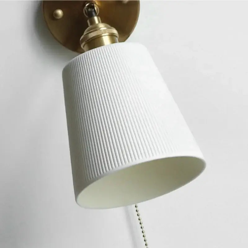 Gold ceramic led wall sconce with ribbed shade for bedroom