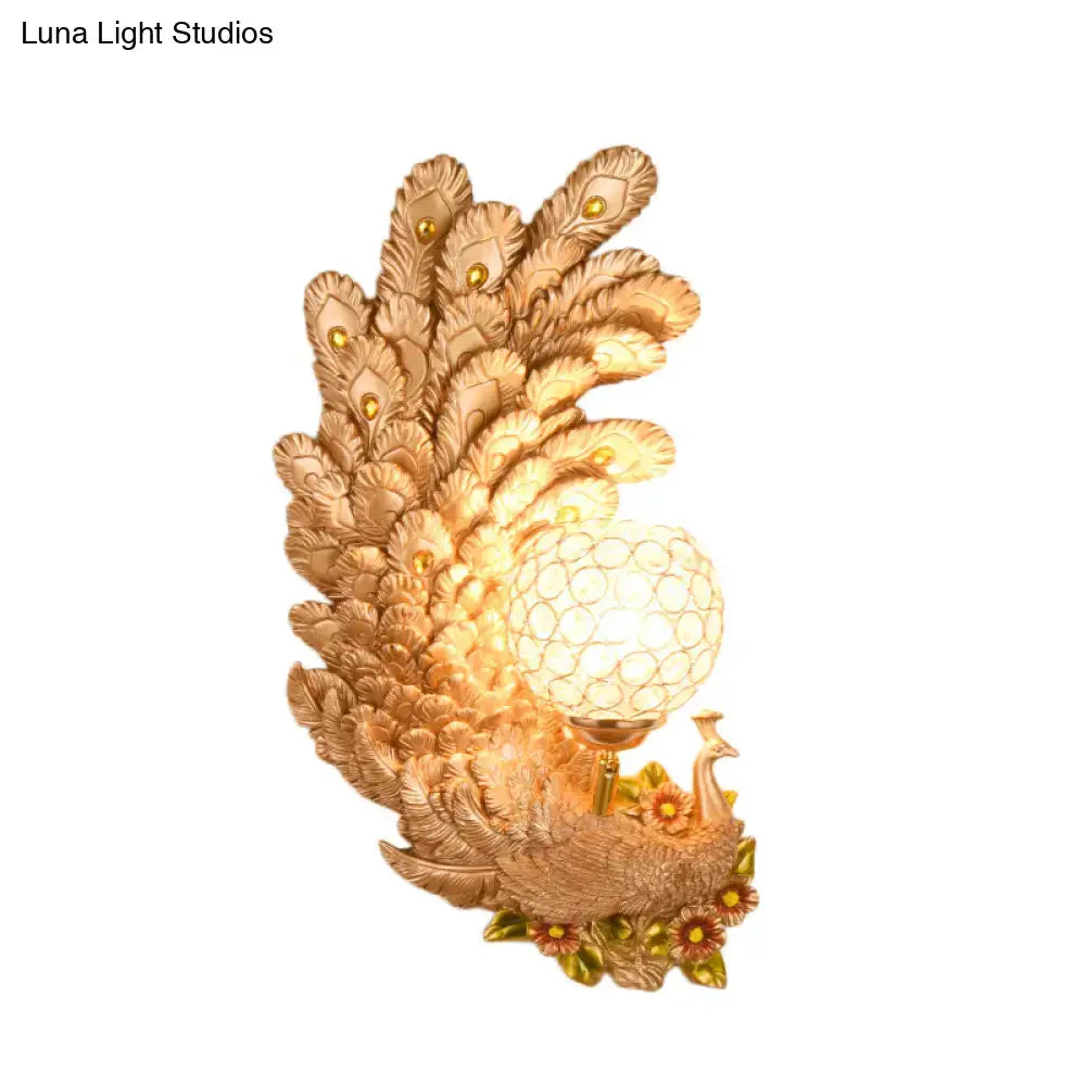 Golden peacock wall light with crystal shade – living room yellow & green