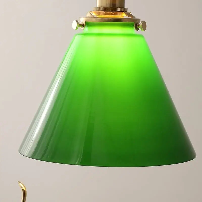 Green glass pendant light with copper canopy for dining room