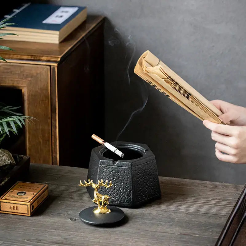Hexagonal black pottery ashtray with gold deer lid for living room