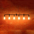 Industrial black pipe island light with beer mug glass shade dining room